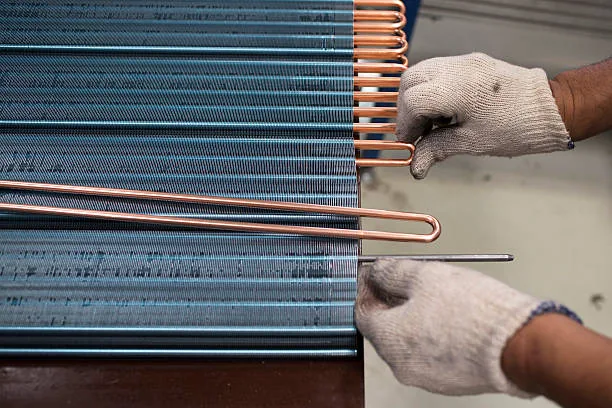 Air conditioner condenser coil components